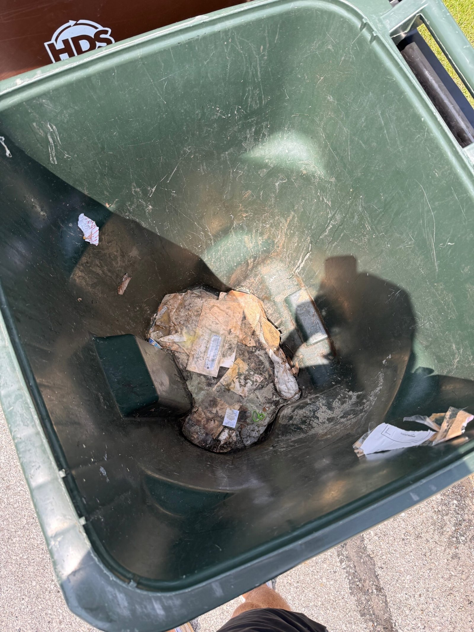 Dirty trash can before cleaning