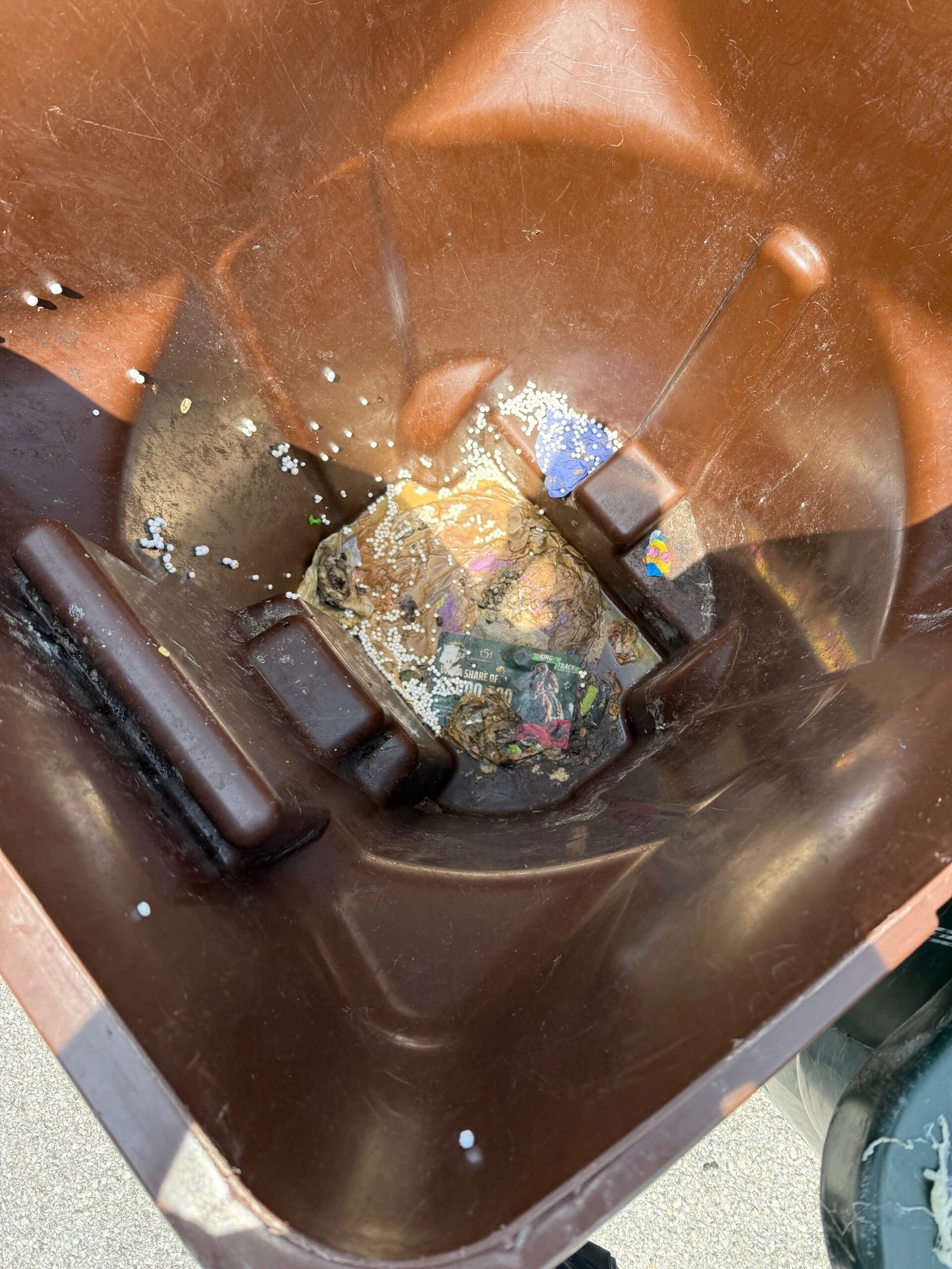 Dirty trash can before cleaning